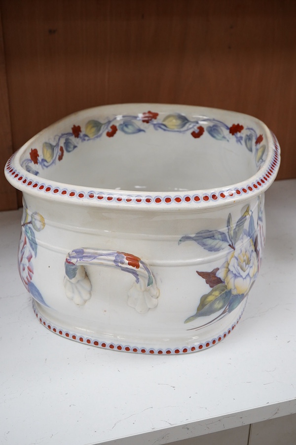 A 19th century Staffordshire pottery two handled footbath, (repaired), 50cm wide